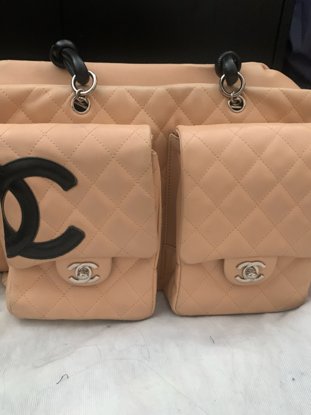CHANEL Quilted Peach Shoulder Bag with Black CC Accent